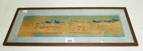 Carved bas relief oriental cork picture of houses set on a river, with trees, birds and a junk, 13 x
