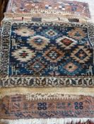 Small bokhara style wool rug with two rows of octagonal guls and two Eastern wool saddle bag