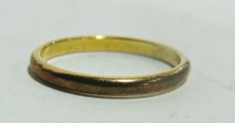 Gold coloured metal wedding band, 1.9 grams approximately together with gold coloured metal and