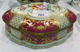 Continental porcelain casket, with shaped sides decorated with floral spray, gilt and puce ornate