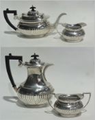 Silver four-piece tea service of reeded form, comprising teapot, coffee pot, milk jug and sugar