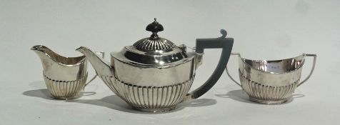 A Victorian silver bachelor's three-piece tea set of half reeded form, comprising teapot, cream