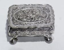 A Chinese silver-coloured metal rectangular box with dragon and pierced fretwork decoration,