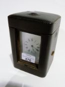 French brass repeating carriage clock, with panelled handle, and staggered plinth base, in leather