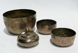 An Eastern white metal engraved bowl together with a pair of smaller bowls and a bowl and cover