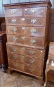 A Georgian walnut chest on chest with straight moulded cornice, two short and three long graduated