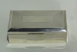 A rectangular silver cigarette box with engine turned cover and cedar wood lining, Birmingham