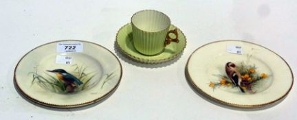 Two Royal Worcester plates, decorated with birds, signed W.W. Powell, and a Royal Worcester cup
