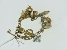 9ct gold charm bracelet with gold and other charms, 17 grams approximately