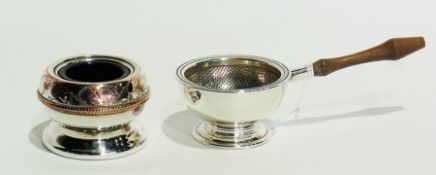 A silver tea strainer and stand  with turned wooden handle, Birmingham 1963 together with a