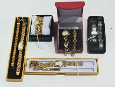 Five boxed lady's wrist watches on gold coloured and stainless steel bracelets etc