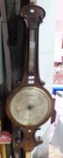 19th century walnut wheel barometer by J Gouldar, Gloucester with raised scroll borders,