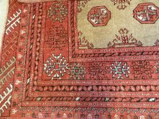 Small modern Afghan prayer rug, the beige ground with two rows of elephant foot guls, 71 x 117 cm