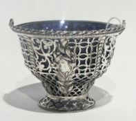 A Georgian silver sweetmeat basket with original blue glass liner, with open fretwork design and