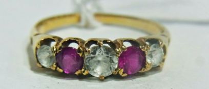 Gold coloured metal ring set with pink and white stones