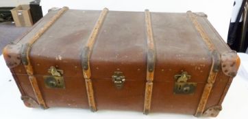 "Deluxe" wooden bound brown travelling trunk, early to mid-twentieth century, with labels