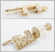 Carved bone thread bobbin, with clamp, carved and pierced with butterflies, and ivory thread