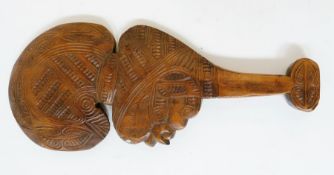 Maori style paddle, carved decoration and carved handle