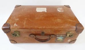 Leather suitcase with Bombay stickers etc