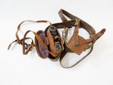 WWII leather Sam Brown belt with sword, frog and leather cased binoculars