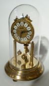 'Andy' gilt metal four hundred-day perpetual timepiece, on circular base under plastic dome, 31cm