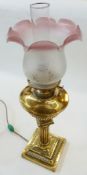 Brass oil lamp, with pink and white shade, circular Corinthian column on plinth base with reeded