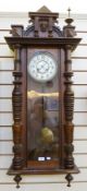 Nineteenth century stained wood Vienna Regulator style wall clock, with mask, applied mould and