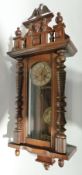 Nineteenth century stained wood and walnut Vienna Regulator style wall clock, with eagle and mask