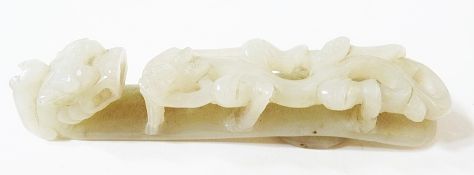 Japanese carved nephrite jade belt buckle, in the form of a dragon, 10.5cm long