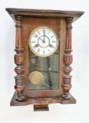 Stained wood wall hanging clock, with glazed sides, turned split forepilasters, striking movement,