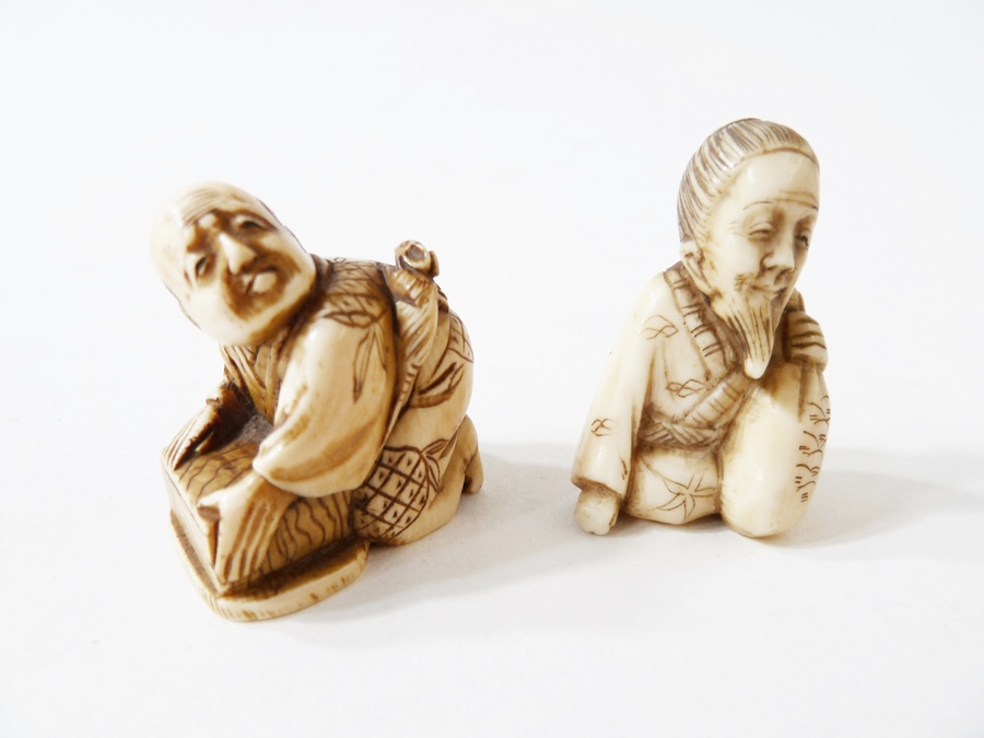 Two Japanese netsukes, one in the form of a crouching figure with mouse, 3cm high, the other in