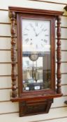 Stained wood wall clock, having mirrored back, pair ring-turned and baluster forepilasters,