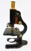 A 20th century microscope by C. Baker, London, in fitted wooden case