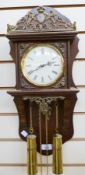 Continental stained wood and gilt metal weight-driven wall clock,  with ornate pierced gilt