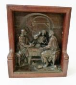 Bronze effect two dimensional plaque, religious scene of Christ seated at a table with two men, in