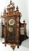 Nineteenth century walnut Vienna Regulator style wall clock, having horse pediment with turned