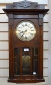 Twentieth century oak case mantel clock, with geometric raised pediment and moulding to the case,