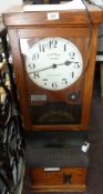 National Time Recorder Company Ltd. London, with oak case enclosing National Electric clock , having