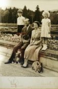 Black and white photograph of Elizabeth II and family, dated 1956, with possible signatures (?),