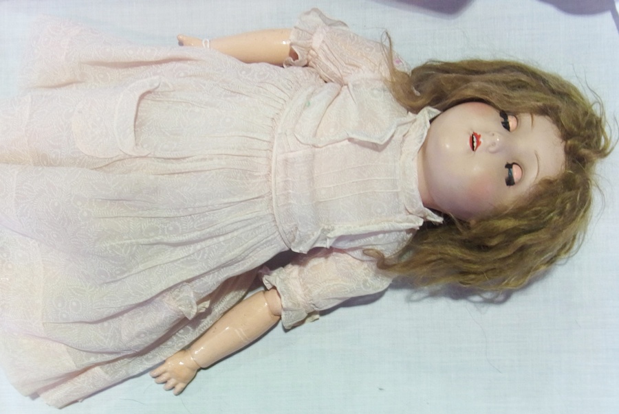 HW (Handwerck (?) bisque headed doll, with sleeping blue eyes, open mouth and pink printed gauze