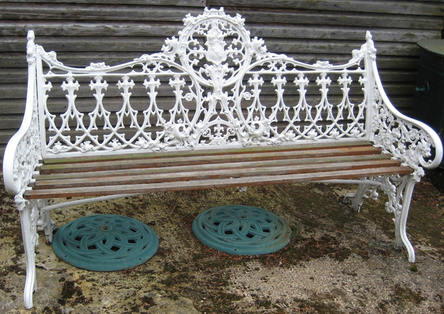 Early twentieth century Coalbrook white painted cast iron bench, the wooden seat in need of repair
