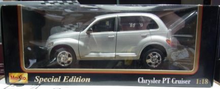 A 1/18 scale diecast Maisto model of a Chrysler Cruiser, a Franklin Mint  Bristol 60, and a Mack