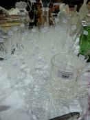 Quantity of cut glass wines and sherry glasses, three champagne flutes and two moulded glass