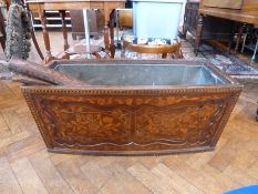 Nineteenth century Dutch marquetry bow shaped crib, with rails etc. and also with tin planter liner,