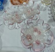 Art Deco peach-coloured glass dressing table set and 1950s pink and white glass bowls, with embossed