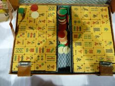 Mahjong set, old set of wooden spillikins, coloured counters and leather shaker