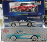 A 1/12 scale Mobil diecast model of a Mini Cooper, an Anson model of a Viper RT10 and a Solido model