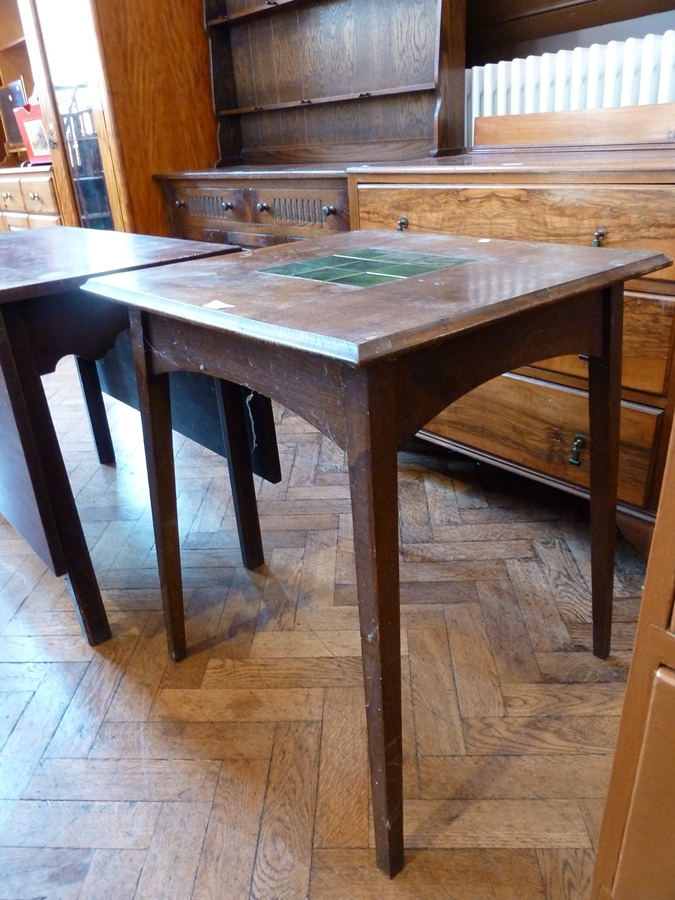 An Edwardian oak square top side table, inset with green glazed tiles on square tapering legs, width