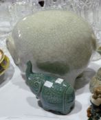 Two twentieth century stoneware model elephants, one marked "Baan Celadon" and another, larger (2)
