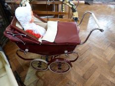 Mid-twentieth century red coach built metal pram, with hood and cover